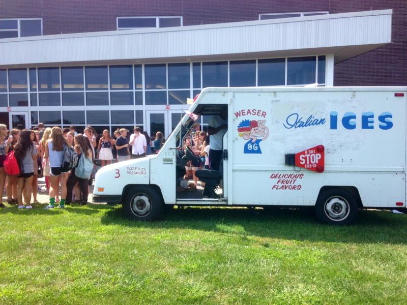 Students cool off with a visit from an Italian ice truck on the first day.