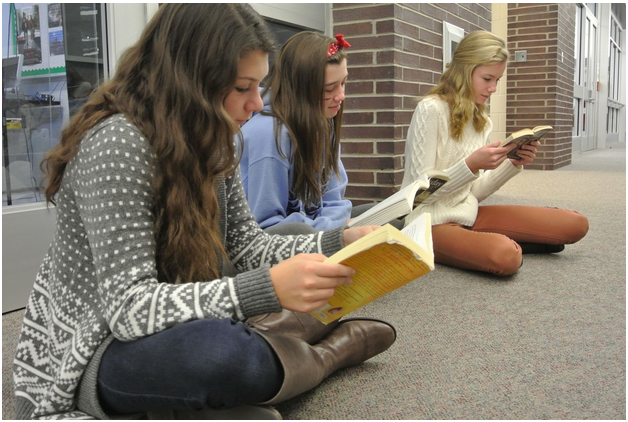 (From left) Freshman Michelle Etienne of Avon-by-the-Sea, Brigid Garrett of Wall, and Audrey Mannion of Brielle taking part in the first D.E.A.R. Monday.
