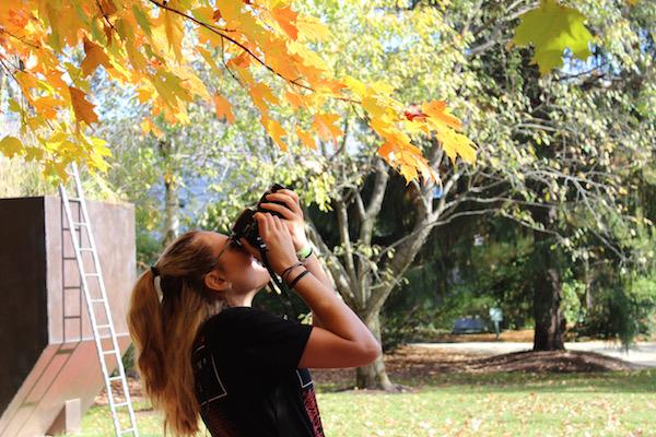 Senior Caitlyn Siminerio takes a photo during a Photo Club sponsored trip to Grounds for Sculpture in the 2015-16 school year.