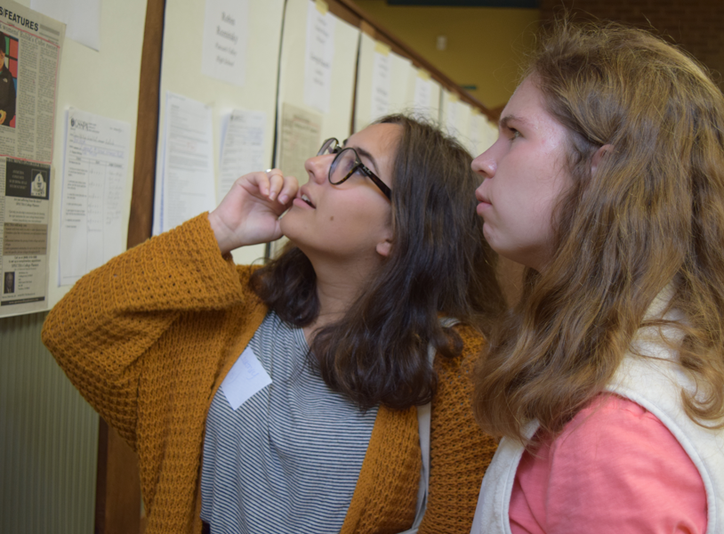 Juniors Courtney Kushnir of Colts Neck and Elizabeth Klemm of Middletown take a look at the work of New Jersey high school journalists on display at Fall Press Day. 