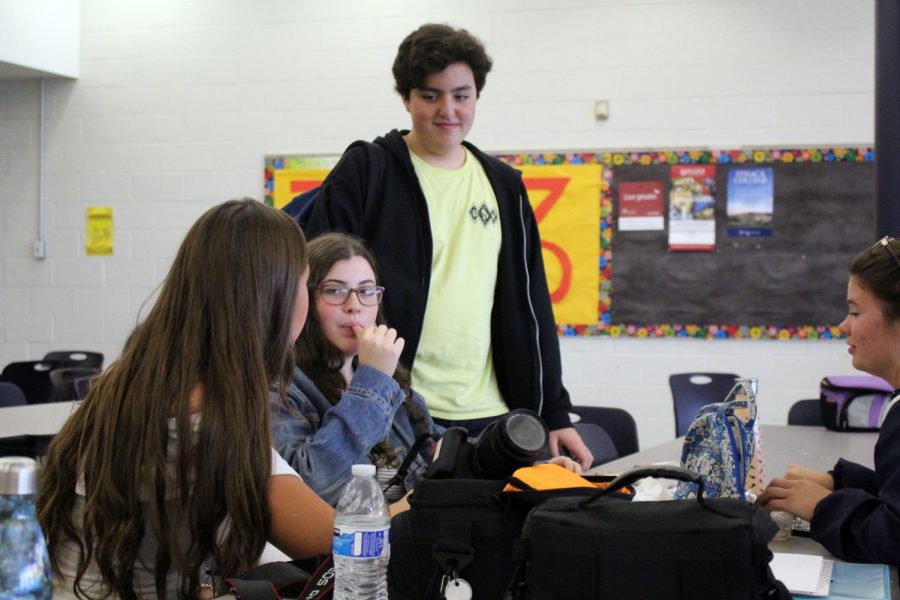 Enjoying their lunch period, juniors, from left, Marisa Harczuk of Tinton Falls, Tali Petto of Marlboro, Liam Marshall of Sea Girt, and Alex Herrmann of Brielle talk about their costumes and plans for this coming weekend and Halloween.