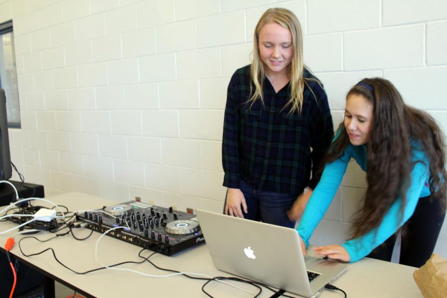 Choosing the next song to play, junior, left, Caroline Monaghan of Middletown and senior Julianne Sackett of Rumson were the disc jockeys for today’s DJ Friday. The pair played an assortment of R&B, rap and pop music.