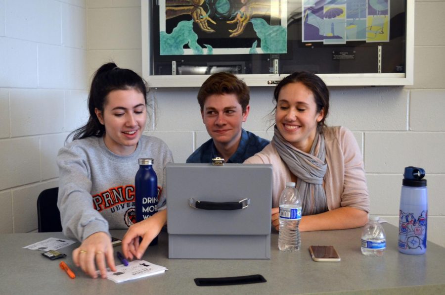 During lunch, NHS is selling Boo Grams full of treats that will be delivered with a note to fellow classmates during third period on Tuesday Oct. 31. From left, seniors Delia Noone, Dylan Josephson and Julianne Sackett banter as they wait for students to buy the grams for $2 apiece.