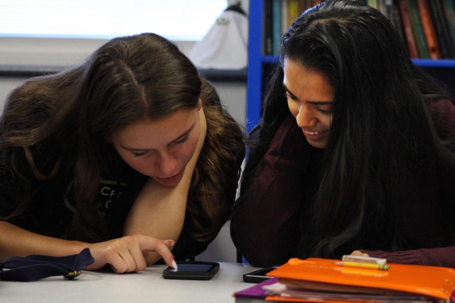 During third period, juniors Khushi Kadakia, right, of Tinton Falls and Colleen Megerle, left, of Colts Neck practice their dialogue, a regularly assigned project by Spanish teacher Gail Plumeri.