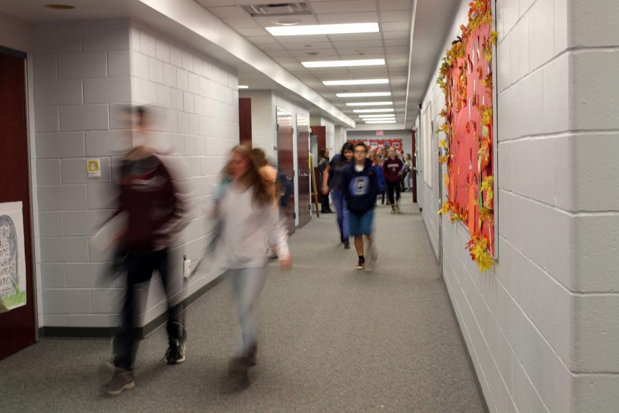 Students such as sophomore Matt Sherwin walk through the hallway after lunch. They are rushing, as they only have three minutes to get between the lunchroom and their upstairs classrooms. 
