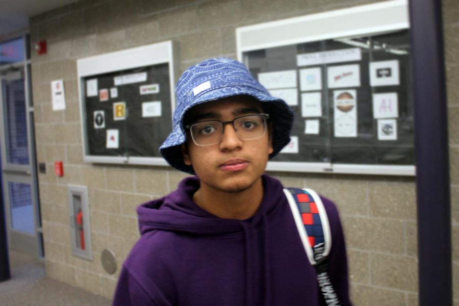 Students dressed in Hawaiian shirts and sunglasses on Thursday to earn participation points for Tourist Day. Junior Parthesh Patel of Freehold wears a bucket hat. “I feel that it brings out my more tropical side,” Patel said.