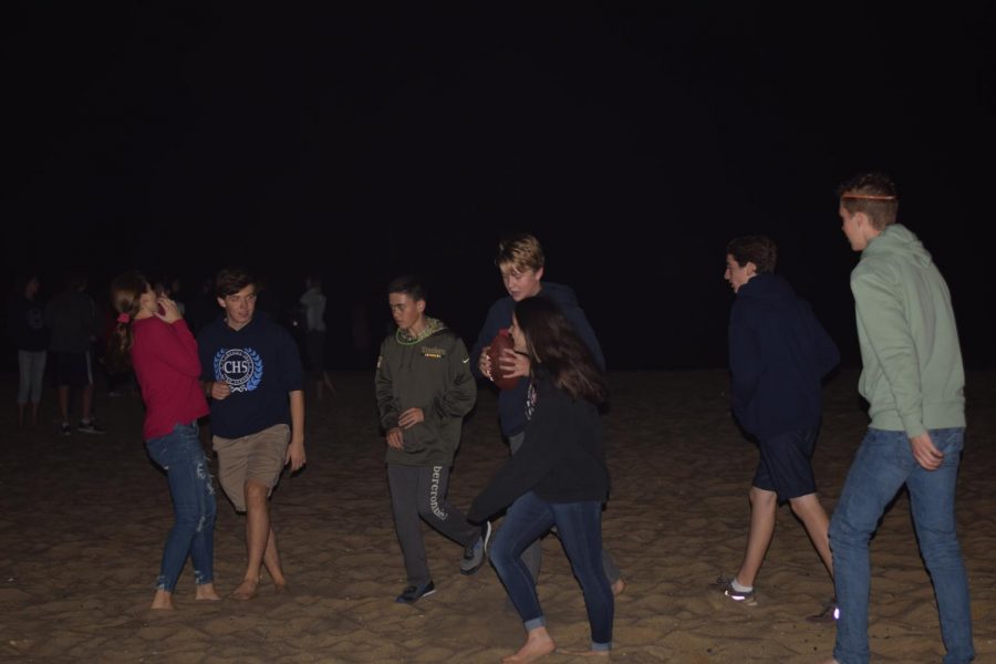 Freshmen play football on the beach during the PSFA event on Oct. 5.