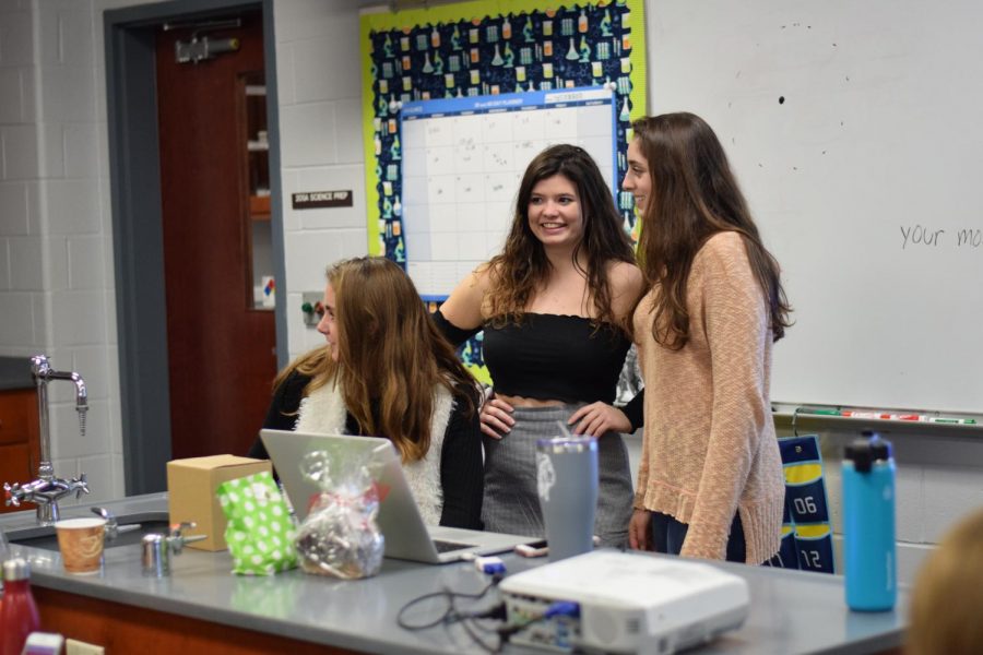 Seniors, from left, Grace Treshock of Monmouth Beach, Alex Herrmann of Brielle and Audrey Wilenta of Wall teach chemistry for Erin Wheeler. They worked with seniors (not pictured) Jules Andersen of Howell and Kathryn Jemas of West Long Branch.
