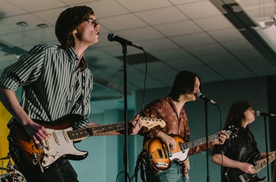 Junior Ryan Swanson of Brielle, left, and senior Kevin Clark of Spring Lake, center, won the 2019 Battle of the Bands with their band The Boys.