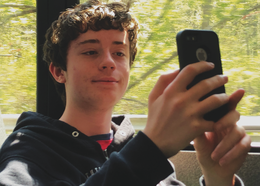 Freshman Ryan Hart of Freehold takes selfies during his bus ride home from school.