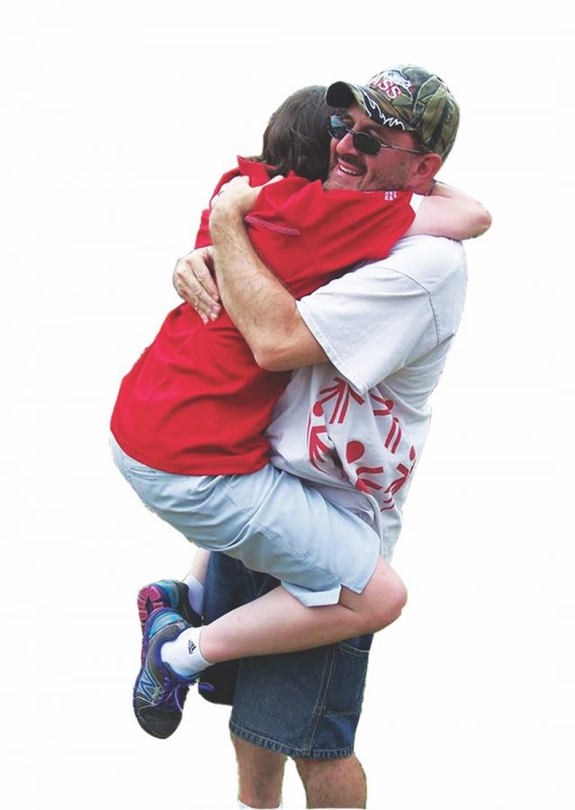 Stengele hugs Hannah after she won a gold medal at the 2014 Special Olympics National Games.