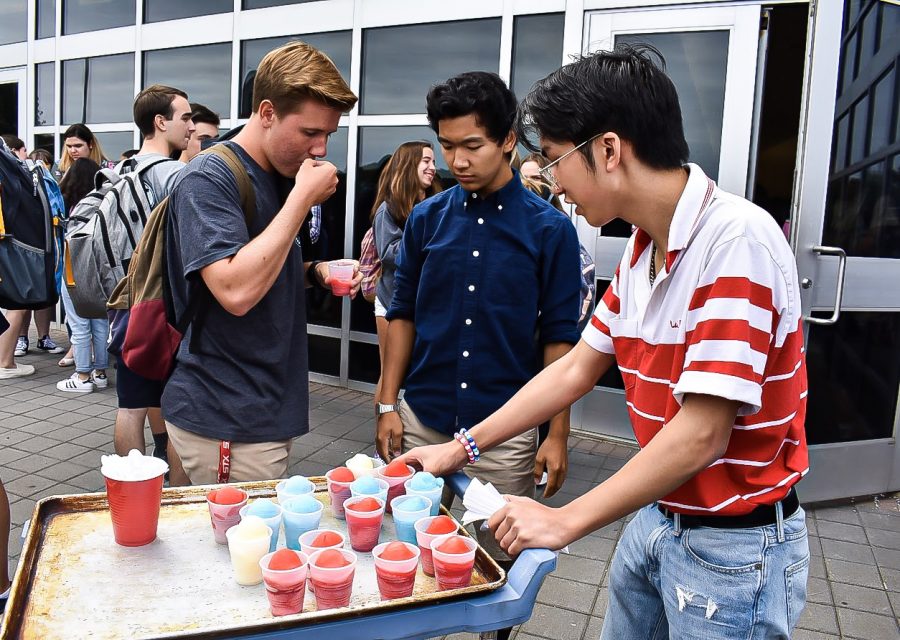 Senior Mike Cielecki of Spring Lake Heights eats italian ice with SGA members and seniors Evan Kuo of Tinton Falls and Liam Jamolod of Howell.