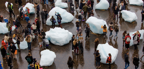 Viewers observe Olafur Eliassons Ice Watch outside the Tate Modern gallery in Bankside, London on Dec. 17, 2018.
