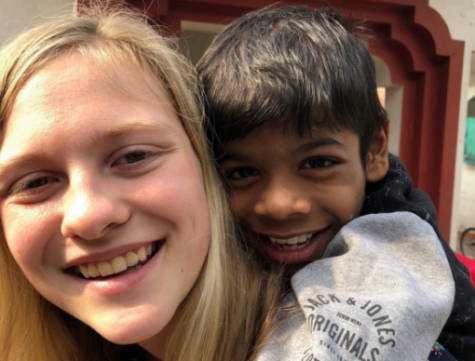 Jodry, left, holds friend Shiva on her back in January 2020 at One Life to Love Orphanage in New Delhi, India.