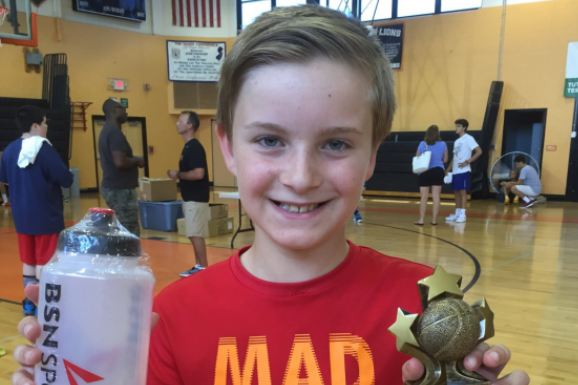 Oldenski celebrates winning “Most Improved Player” at a summer
basketball camp in August 2017. He was diagnosed less than a year later.