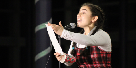 Junior Danielle Lirov of Marlboro shines on stage while performing “Taylor, the Latte Boy” at Coffeehouse on Dec. 10. The traditional CHS event was the first in-person fundraiser hosted by the Class of 2023 due to the COVID-19 pandemic.
