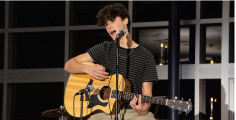 Sophomore Tanner Grigoli of Ocean plays the guitar CHS Coffeehouse 2021.