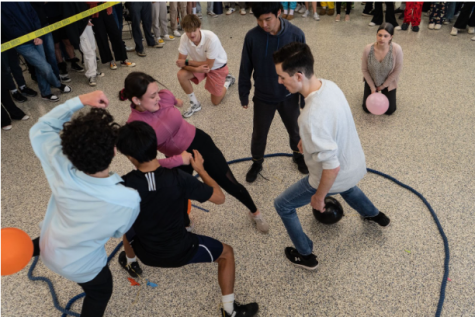 Junior Jordan Juliano battles sophomore John Ferro while junior Kelly O’Toole takes on seniors Jiachen Pan and Luke Chrzan in Balloon Pop (in order from left to right).

