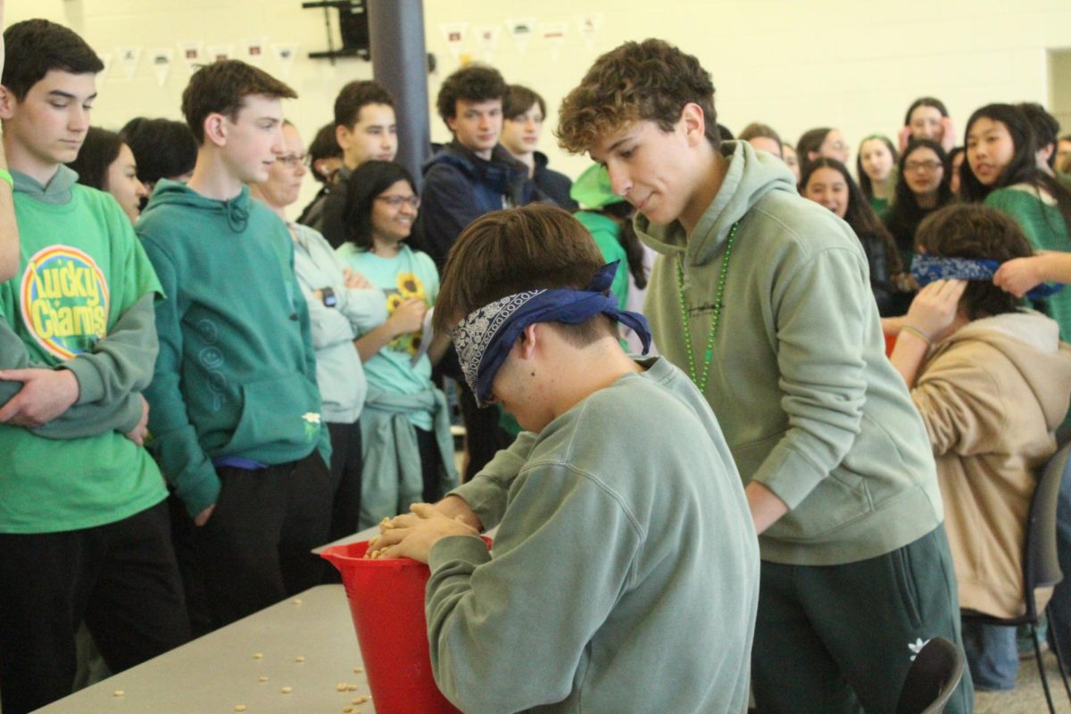 Junior Thomas Tilton tries to dig through lucky charms and find a marshmallow.
