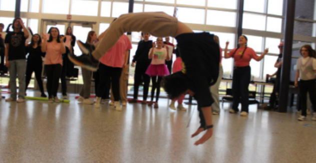 Freshman Brian Kaplan showcases his gymnast skills during Lip Sync on March 8, 2024.