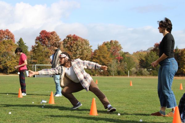 Junior, Spencer Nunez, participates in the catching portion of the Fall Spirit Week relay race.

