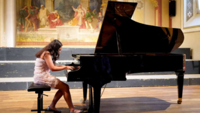 Sophomore Alexandra Marmut plays classical piano at a performance in Brixen, Italy.