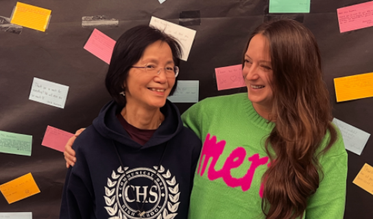 Catherine Kuwera stands in front of farewell messages from students and staff on Dec. 20, 2024.