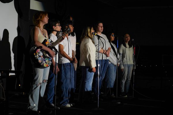 CHS’s Choir Club performs “Can’t Catch me Now” by Olivia Rodrigo at the 2024 Coffeehouse hosted by the junior class.